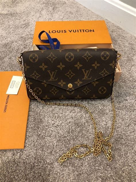 louis vuitton black bag with gold chain|Louis Vuitton wallet with chain.